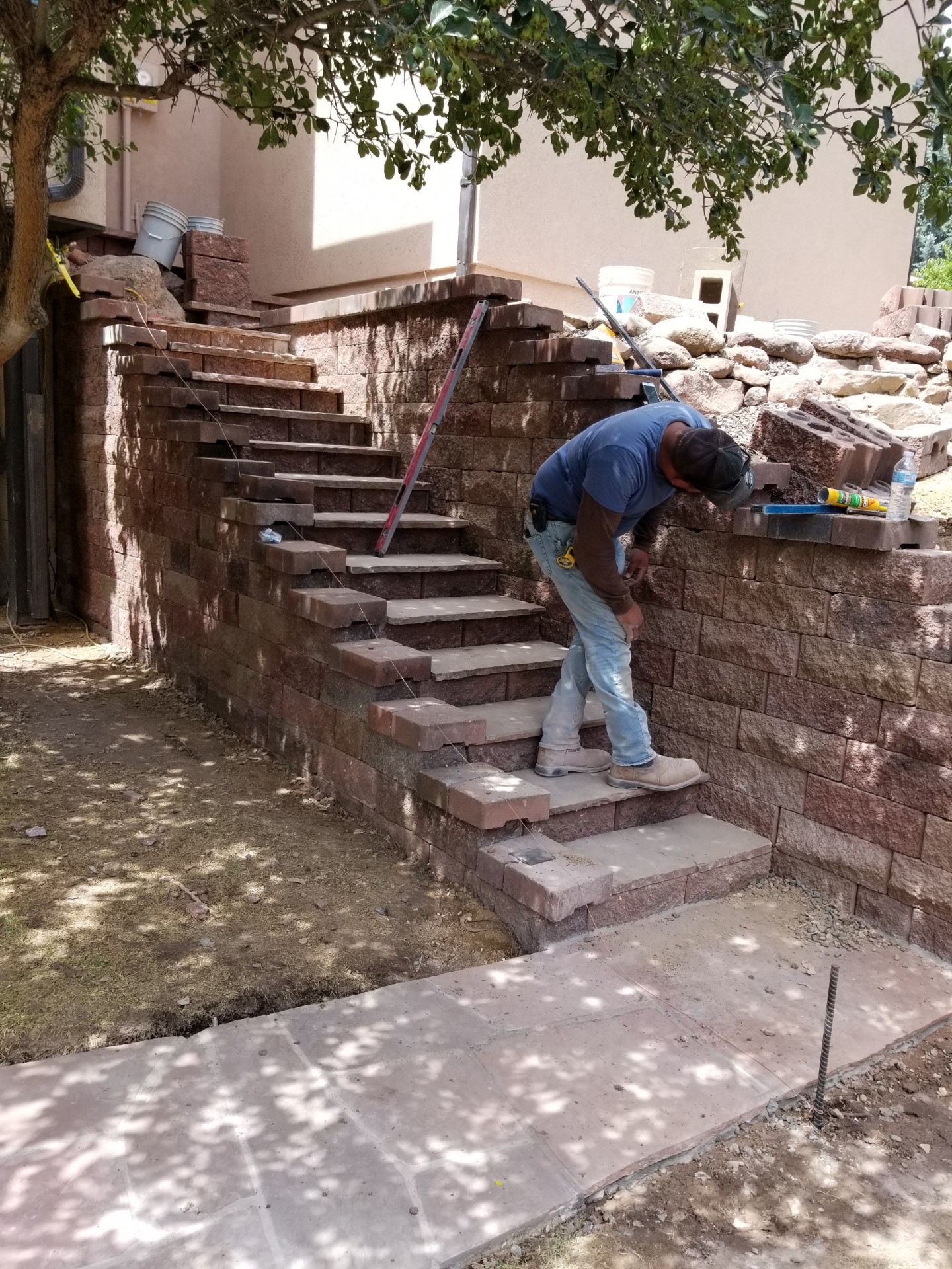 Workers installing flagstone patio